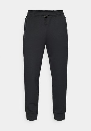 Schwarze sportliche Jogginghosen mit einem elastischen Bund und Kordelzug, seitlichen Reißverschlusstaschen und gerippten Bündchen. Hergestellt aus einem weichen, strukturierten Stoff.