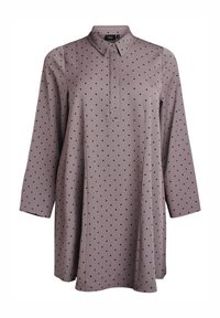 Pitkähihaine mauve-tunika mustilla pilkuilla, kärjellinen kaulus ja piilotettu nappilista edessä.