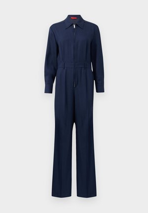Navy sininen haalari, jossa on vetoketju edessä, kaulusk சட்டி , pitkät hihat ja vyöllä varustettu vyötärö. Valmistettu sileästä kankaasta, jossa on suorat lahkeet.