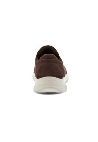 Brown suede sneakers with white rubber soles and textured fabric at the upper. Features rounded toe and padded collar for comfort.