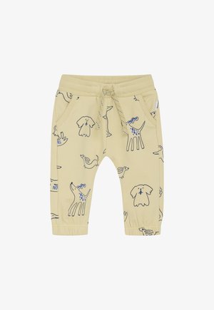 Beige peuterpants met elastische boorden en tailleband, voorzakken, trekkoord en blauwe en zwarte tekeningen van een hond en konijn.