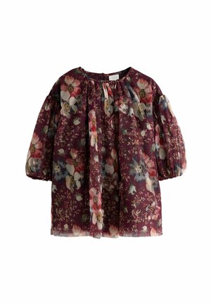 Blouse florale en tissu bordeaux transparent. Elle présente des manches bouffantes, un col froncé et un imprimé floral coloré avec des accents de rose, bleu et crème.