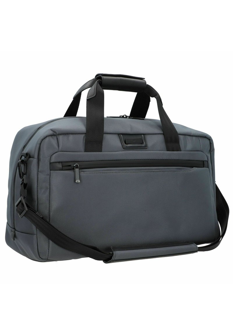 Szary materiałowy worek sportowy o ustrukturyzowanym kształcie. Posiada podwójne uchwyty, regulowany pasek na ramię oraz przednią kieszeń na zamek błyskawiczny.