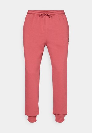 Heathered rosa joggebukser med elastisk midje og snøring, med avsmalnende ben og ribbestrikkede mansjetter ved anklene.