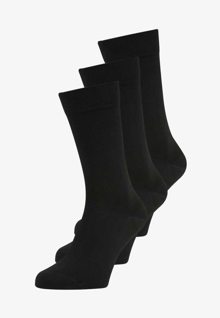 Meias pretas em um pacote de três, feitas de um tecido liso e elástico. Apresentam um punho canelado e têm um comprimento standard com um design simples.