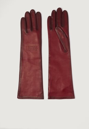 Pair of long, burgundy leather gloves with stitching details and a circular embossed logo on the left glove back, laid flat on white background.