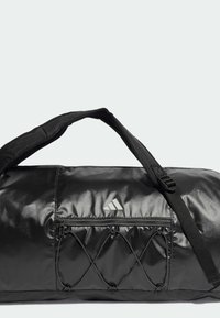 Black duffel bag made of glossy fabric, features a zippered pocket, and a mesh exterior pocket with diagonal stitching. Adjustable strap included.