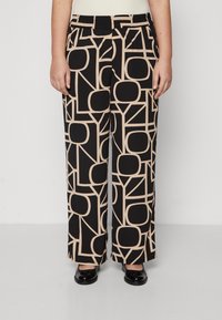 Pantalones de pierna ancha en color negro y beige con un estampado, que cuentan con una cinturilla elástica, con formas geométricas audaces y un tejido suave y ligero.