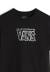 Sort bomulds T-shirt med et hvidt "VANS" logo i barbwire-stil i centrum. Klassisk crew neck-design med korte ærmer.