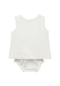 Vitt ärmlöst linne med spetsdetalj och gul blommönster vid fållen, matchat med en vit blöjbyxa. Mjuk bomullstyg.