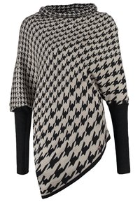 Losse poncho in houndstooth patroon, beige en zwart. Voorzien van geribde zwarte mouwen en een colhals. Zachte brei-textuur.
