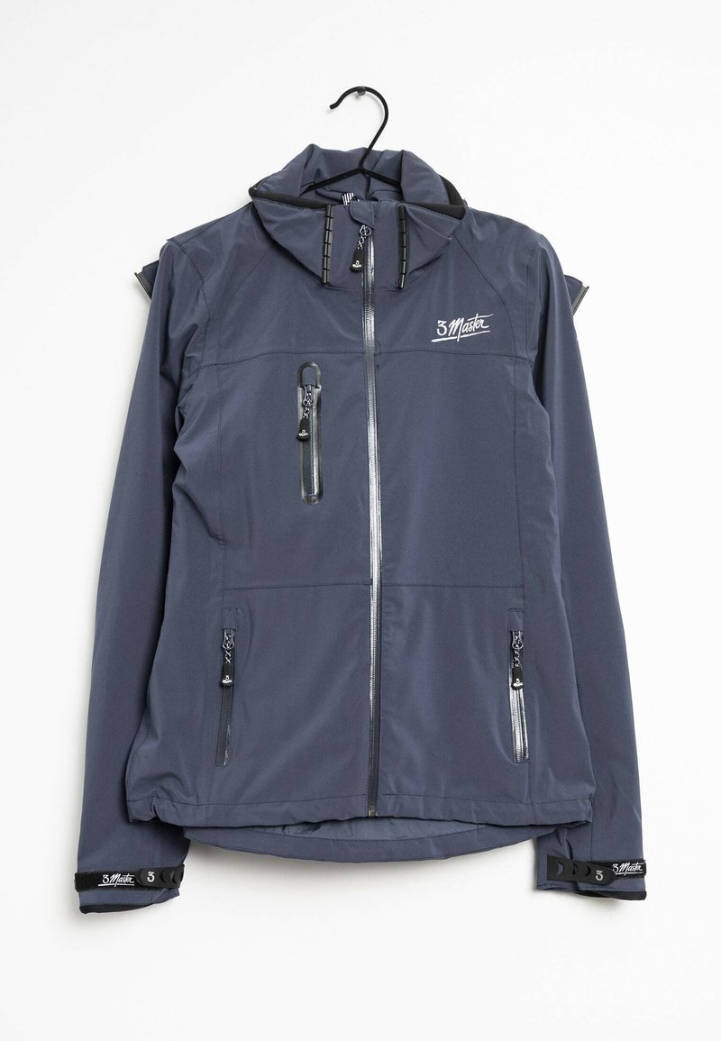 Veste à capuche bleu foncé avec poches zippées à l'avant et sur la poitrine, fermeture éclair frontale et logo de marque sur la poitrine et les poignets, suspendue sur un cintre noir.