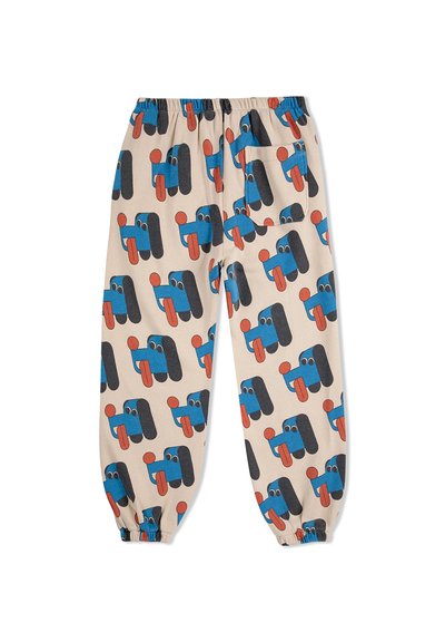 Beige Hosen mit einem wiederholten grafischen Muster aus blauen Figuren mit roten Akzenten auf einem leichten Stoff. Elastischer Bund und Bündchen.