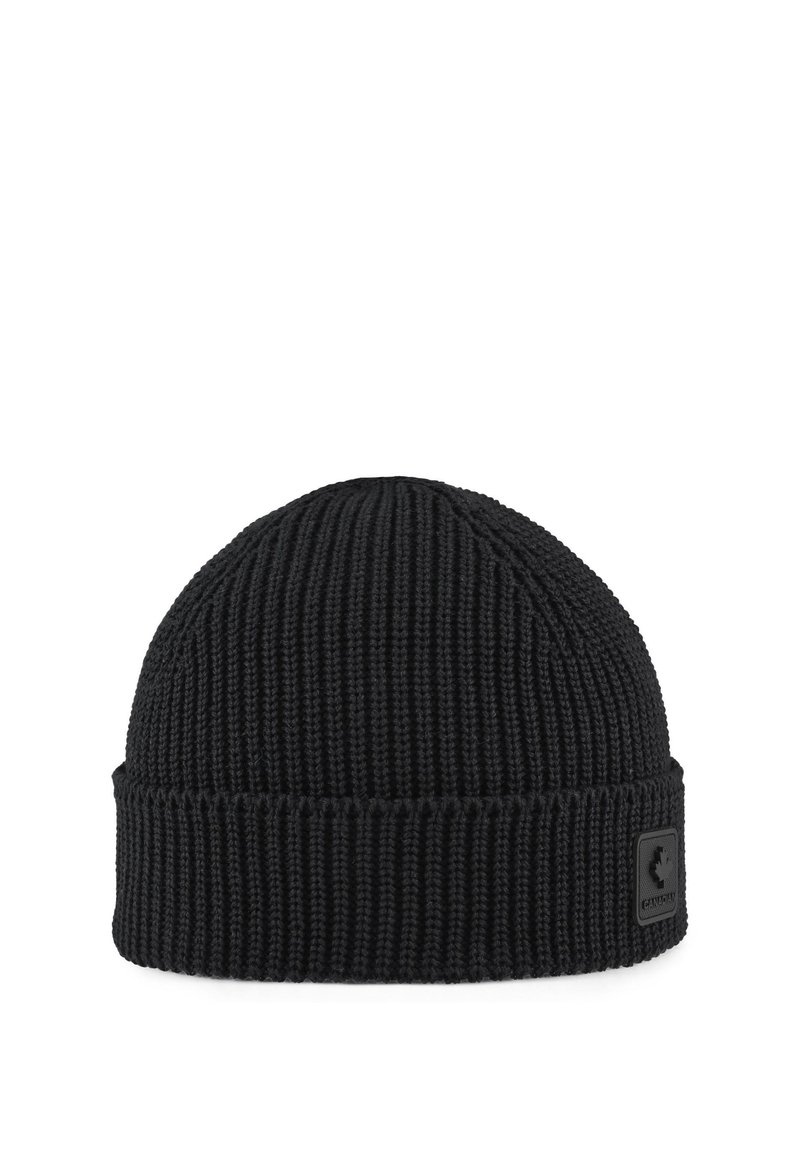 Gorro de punto negro con textura acanalada, parte superior redondeada y dobladillo doblado. Presenta un pequeño parche de logo negro en la parte frontal.