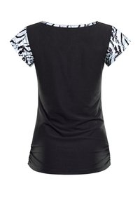 Black top with short patterned sleeves in white and black. Features a round neckline and gathers at the side for a fitted shape.