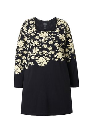 Zwarte lange mouwen tuniek met een vierkante halslijn, met een crèmekleurig bloemenpatroon op de borst en schouders. Zachte katoenen textuur.
