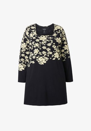 Musta pitkähihaisen tuniikka, jossa on neliön muotoinen pääntie. Tunicassa on kerma-valkoinen kukkakuosi rinnan ja olkapäiden alueella. Pehmeä puuvillakangas.