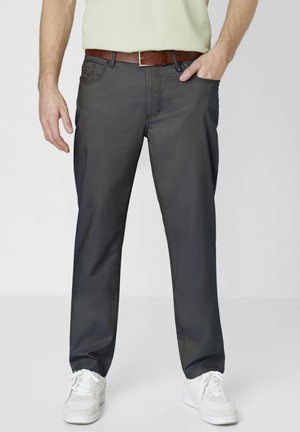 Dark gray cotton trousers with a straight leg design, featuring side pockets and contrasting stitching, paired with a brown belt and white sneakers.