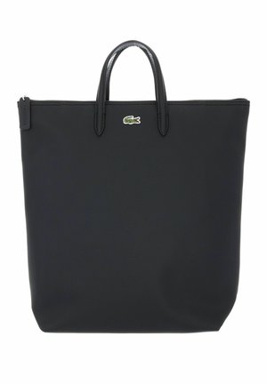 Bolsa tote negra con doble asa, cierre de cremallera y un pequeño logo de cocodrilo verde centrado cerca de la parte superior.