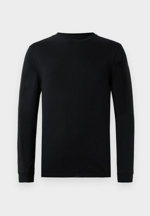 Langermet svart T-skjorte laget av myk bomull. Har rund hals og ribbede mansjetter, med et enkelt og glatt design.