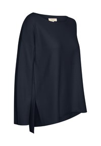 T-shirt ample à manches longues bleu marine en tissu doux, avec un décolleté bateau et des fentes sur les côtés pour plus de détails et de mouvement.