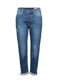 Siniset farkut, joissa on hieman kapeneva lahje, kulutettu ilme ja käännetyt lahkeet. Klassinen viiden taskun malli ja metallinen nappikiinnitys.