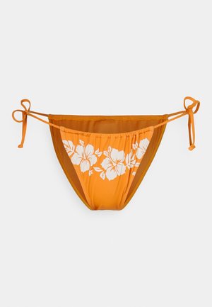 Orange bikini bottom with white hibiscus flower pattern. Features adjustable ties on sides and a smooth texture.