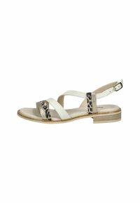 White leather sandal with leopard print accent, crossover straps, and a low block heel. Adjustable ankle strap and cushioned footbed.