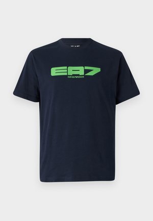 Navy blue cotton t-shirt featuring a large green EA7 logo on the front. Classic crew neck design with short sleeves and a relaxed fit.