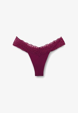 Burgundy thong with a floral lace waistband. Smooth fabric body features minimal coverage with a V-shape design and delicate lace trim.