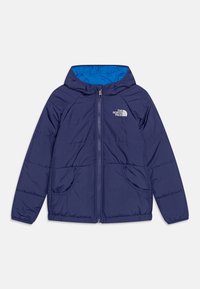 Mörkblå pufferjacka med dragkedja framtill, huva och två framfickor. Insidan är fodrad i klarblått. Diskret quiltad textur.