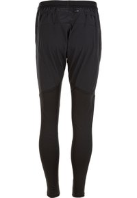 Sorte atletiske tights lavet af strækbart, letvægtsstof med en glat overflade, der har en elastisk talje og sømdetaljer.