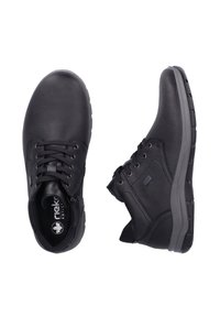 Bottines en cuir noir avec finition texturée, bout rond, fermeture à lacets, col rembourré et semelle en caoutchouc. Comprend une fermeture éclair sur un côté.