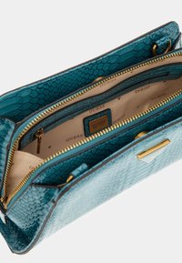 Guess Ručna torbica - blau