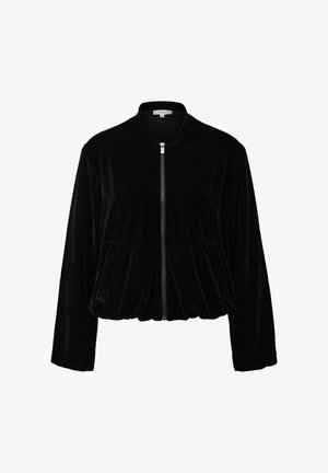 Zwarte fluwelen bomberjack met een ritssluiting aan de voorkant, ronde kraag en twee zijzakken. Beschikt over elastiek aan de onderkant en een zachte textuur.