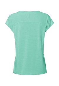 T-shirt pour femmes à manches courtes de couleur vert clair, avec une couture traversant le haut du dos et une coupe décontractée.
