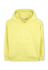Sudadera amarilla de tejido suave, con un logo en relieve en la parte frontal que presenta un diseño de árbol y una capucha con cordón. Puños y dobladillo acanalados.