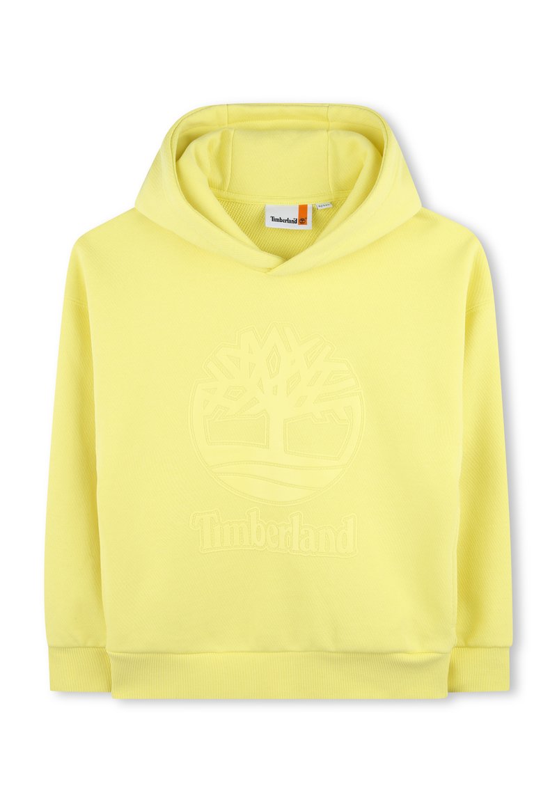 Sudadera amarilla de tejido suave, con un logo en relieve en la parte frontal que presenta un diseño de árbol y una capucha con cordón. Puños y dobladillo acanalados.