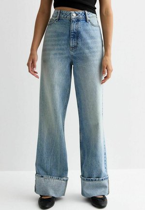 Light blue high-waisted wide-leg jeans with a faded finish, cuffed hems, and traditional five-pocket design. Made of denim material.