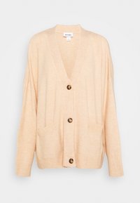 Peach-colored cardigan with a V-neck, ribbed cuffs, two front pockets, and three brown buttons down the center. Soft knit fabric texture.