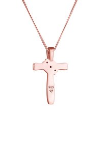 Rose gold kryds vedhæng på en delikat kæde. Har en glat finish, "925" stempel for sølvinhold, og tre små punktformer.