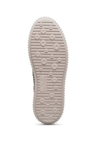 Semelle en caoutchouc, couleur beige clair, présentant des motifs de traction circulaires et ovales, avec des bords festonnés pour une meilleure adhérence.