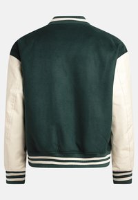 Green and cream bomber jacket with a ribbed collar and cuffs. Textured fabric on the body and smooth leather sleeves. Features striped trim.