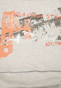 Orange and black stylized bridge graphic with text "HIGH GRADE STYLE" and "est. 1988" on light gray fabric background.