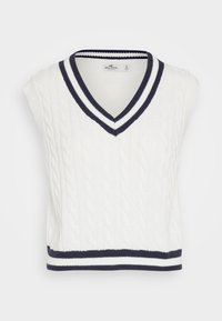 Bílý bezrukávový svetr s pleteným vzorem. Výstřih do V má navy modro-bílé pruhované žebrované lemování u límce a dolního okraje.