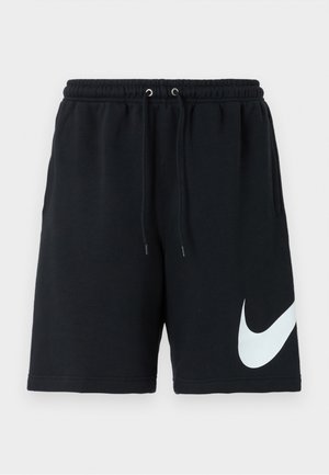 Black cotton shorts with an elastic waistband, drawstring, side pockets, and a large white Nike logo printed on the left side.