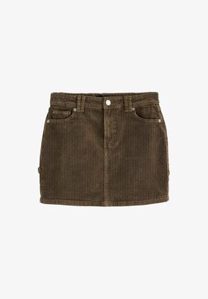 Hnedá kordurová sukňa s vertikálnym ryhovaním, dizajnom s piatimi vreckami, striebornými gombíkmi a priamym strihom. Na spodnej časti má jemný lem.