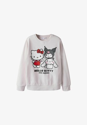 Sudadera rosa claro con gráfico de Hello Kitty y amigos en negro y rojo. Textura suave, cuello redondo clásico y puños acanalados.