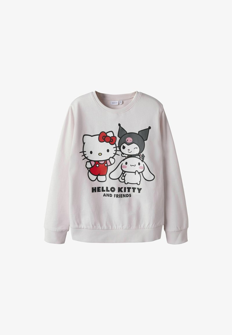 Sudadera rosa claro con gráfico de Hello Kitty y amigos en negro y rojo. Textura suave, cuello redondo clásico y puños acanalados.