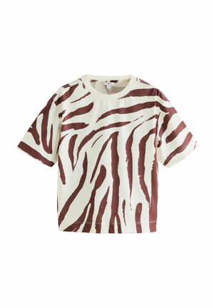 T-shirt kratkih rukava u krem boji s smeškastim uzorkom zebra. Mekani, teksturirani pamučni materijal s opuštenim krojem i okruglim izrezom.